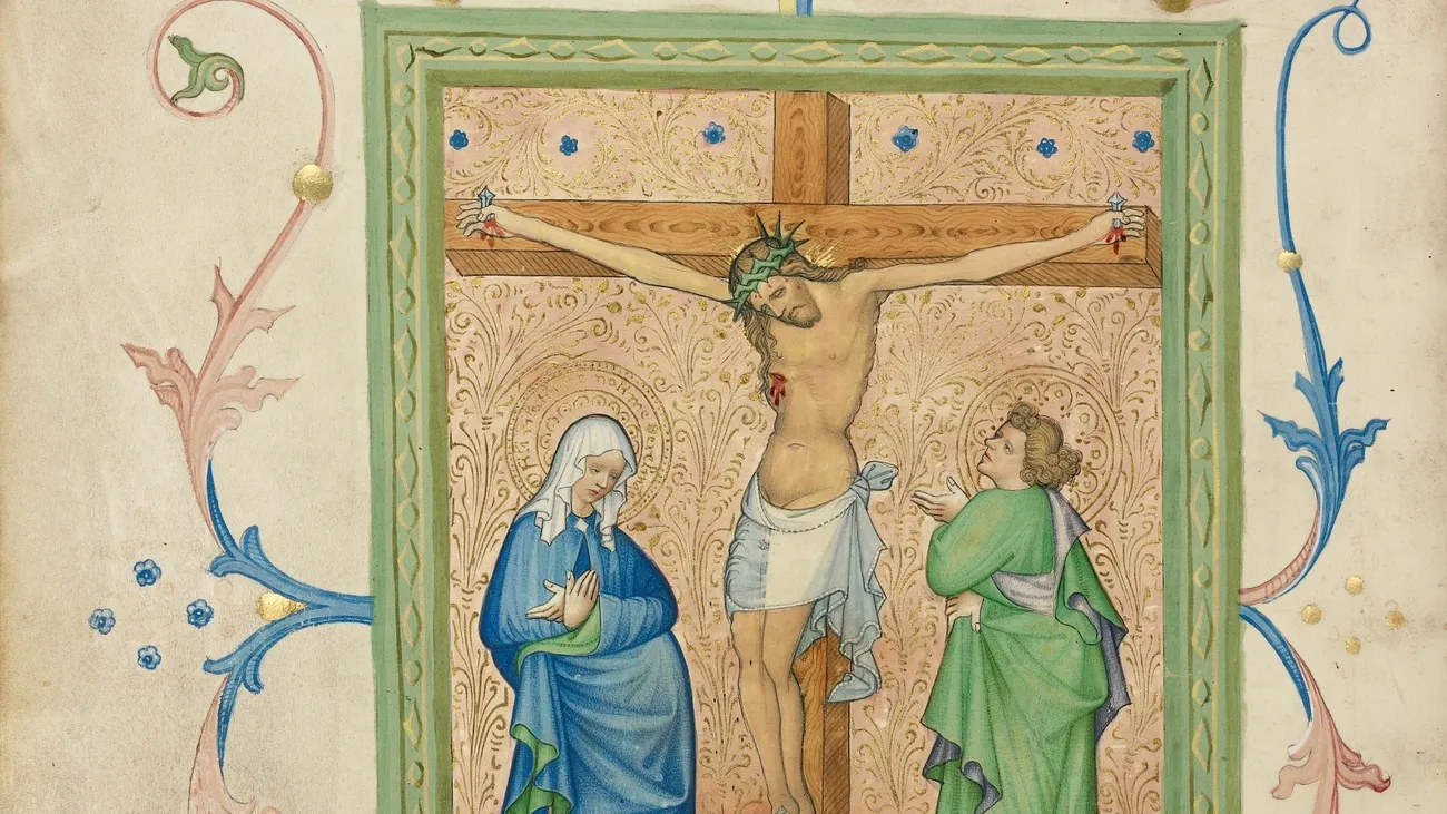 Medieval illustration of Jesus crucified with Mary in blue and John in green beneath the cross, surrounded by decorative floral borders.